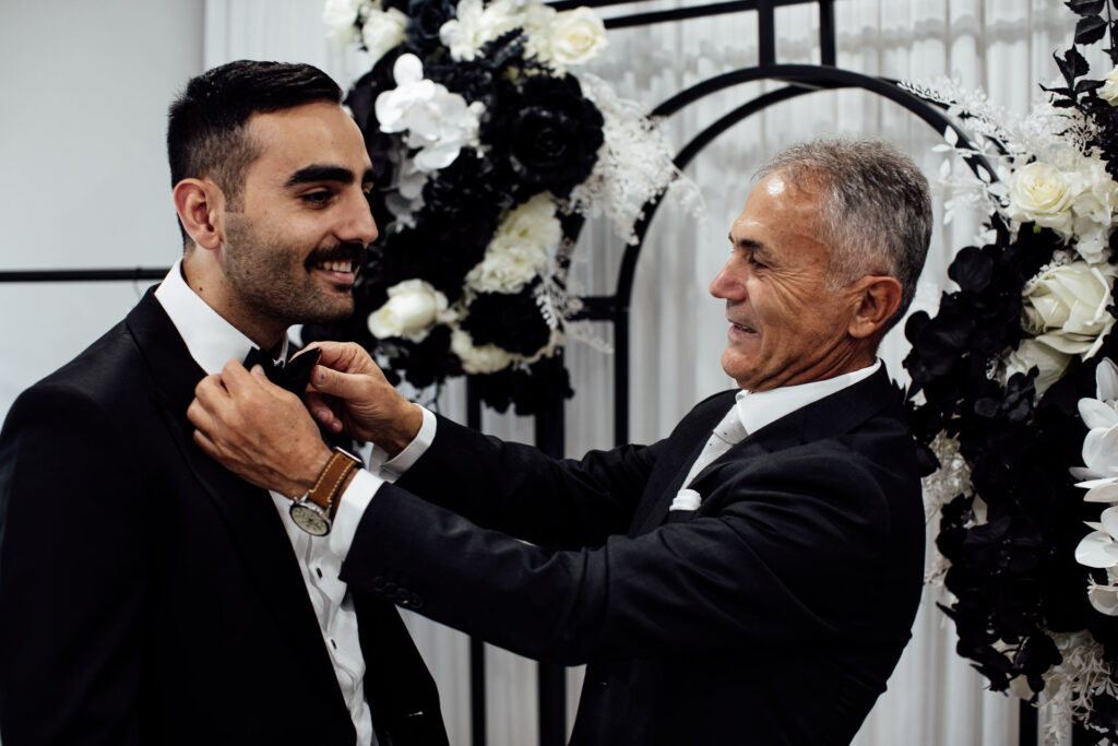 Father helps groom getting ready at Sydney wedding